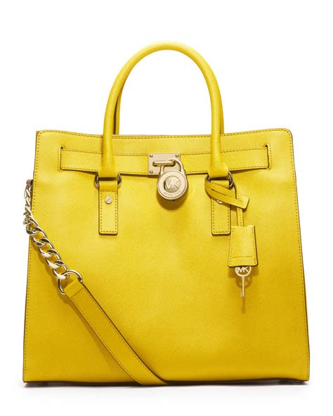 michael kors satchel yellow|Michael Kors pink suitcase.